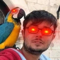 Mitch Flindell, with a parrot on his shoulder